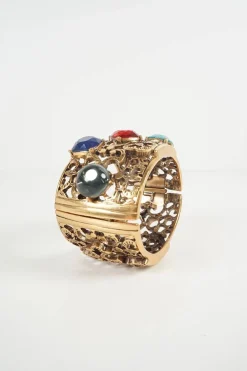 Antique gold colour metal cut out botanical pattern cuff bangle embellished with multi-colour stones