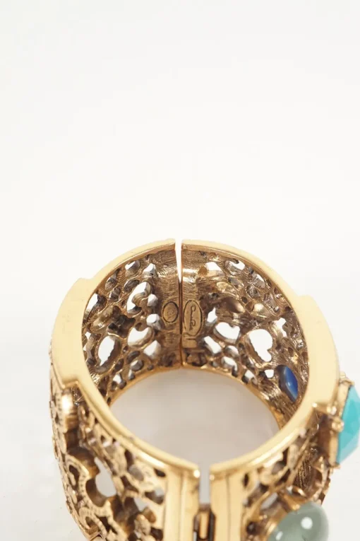 Antique gold colour metal cut out botanical pattern cuff bangle embellished with multi-colour stones