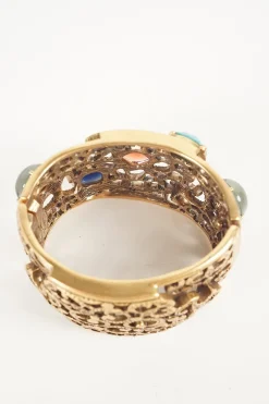 Antique gold colour metal cut out botanical pattern cuff bangle embellished with multi-colour stones