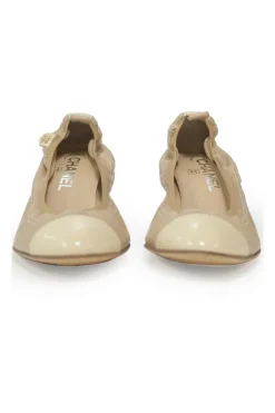 Beige and ivory lambskin low-heel Spirit pumps with contrast cap toe