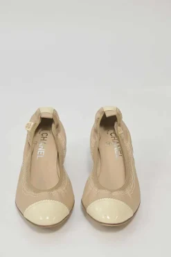 Beige and ivory lambskin low-heel Spirit pumps with contrast cap toe