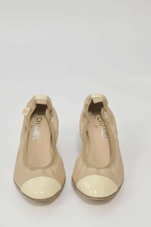 Beige and ivory lambskin low-heel Spirit pumps with contrast cap toe