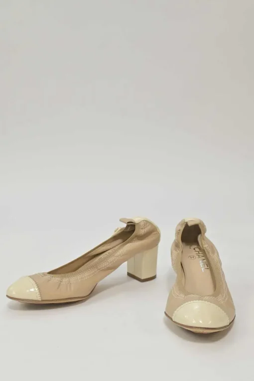 Beige and ivory lambskin low-heel Spirit pumps with contrast cap toe