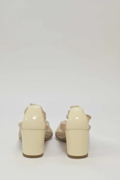 Beige and ivory lambskin low-heel Spirit pumps with contrast cap toe