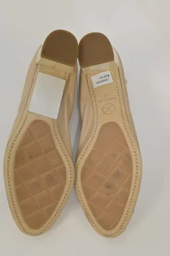 Beige and ivory lambskin low-heel Spirit pumps with contrast cap toe