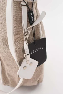 Beige cloth with white leather shoulder strap tote bag