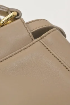 Beige leather Peekaboo satchel with gold-tone metallic hardware and adjustable shoulder strap