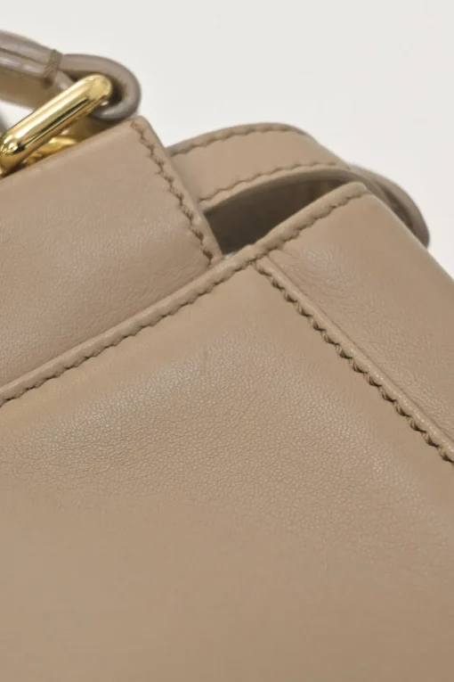 Beige leather Peekaboo satchel with gold-tone metallic hardware and adjustable shoulder strap