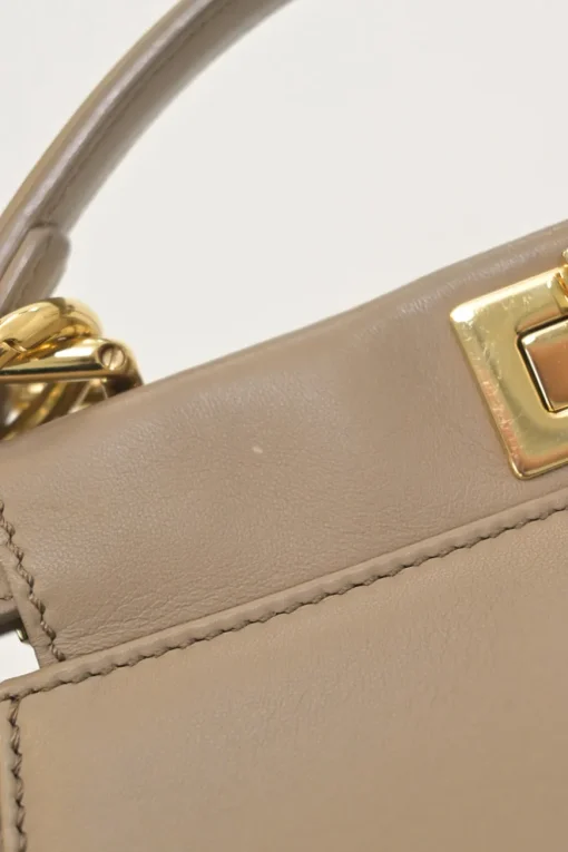 Beige leather Peekaboo satchel with gold-tone metallic hardware and adjustable shoulder strap
