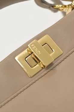 Beige leather Peekaboo satchel with gold-tone metallic hardware and adjustable shoulder strap