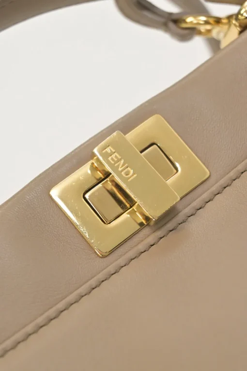 Beige leather Peekaboo satchel with gold-tone metallic hardware and adjustable shoulder strap