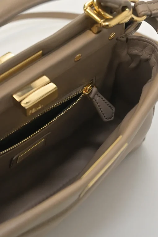 Beige leather Peekaboo satchel with gold-tone metallic hardware and adjustable shoulder strap