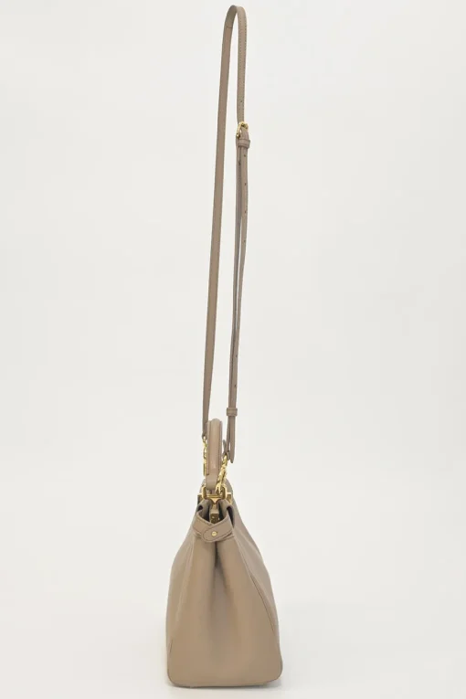 Beige leather Peekaboo satchel with gold-tone metallic hardware and adjustable shoulder strap