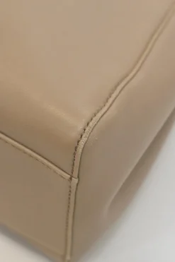 Beige leather Peekaboo satchel with gold-tone metallic hardware and adjustable shoulder strap