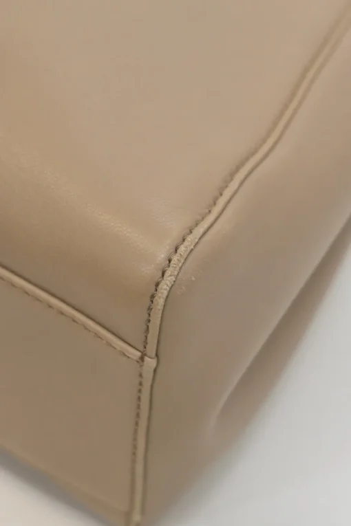 Beige leather Peekaboo satchel with gold-tone metallic hardware and adjustable shoulder strap