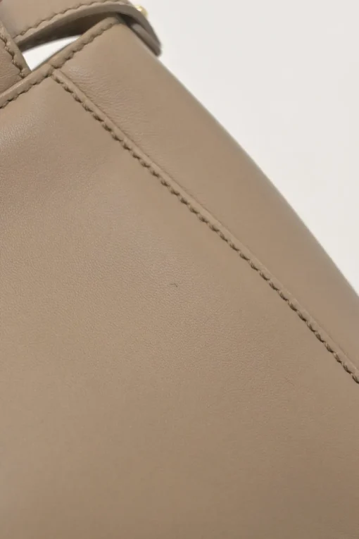 Beige leather Peekaboo satchel with gold-tone metallic hardware and adjustable shoulder strap
