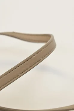 Beige leather Peekaboo satchel with gold-tone metallic hardware and adjustable shoulder strap