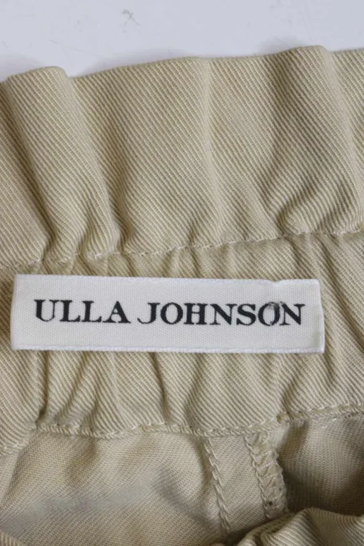 Beige linen twill pull-on button-front paperbag waist tapered leg trousers with slanted hip pockets