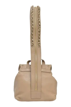 Beige studded leather convertible backpack with zip straps