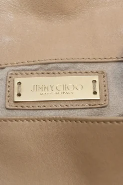 Beige studded leather convertible backpack with zip straps