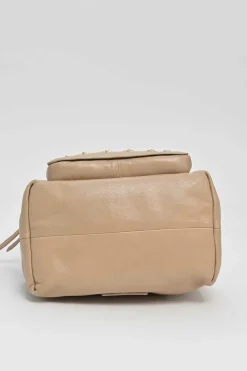 Beige studded leather convertible backpack with zip straps