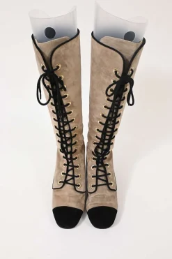 Beige suede lace-up tall boots with contrasting cap toe