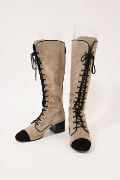 Beige suede lace-up tall boots with contrasting cap toe