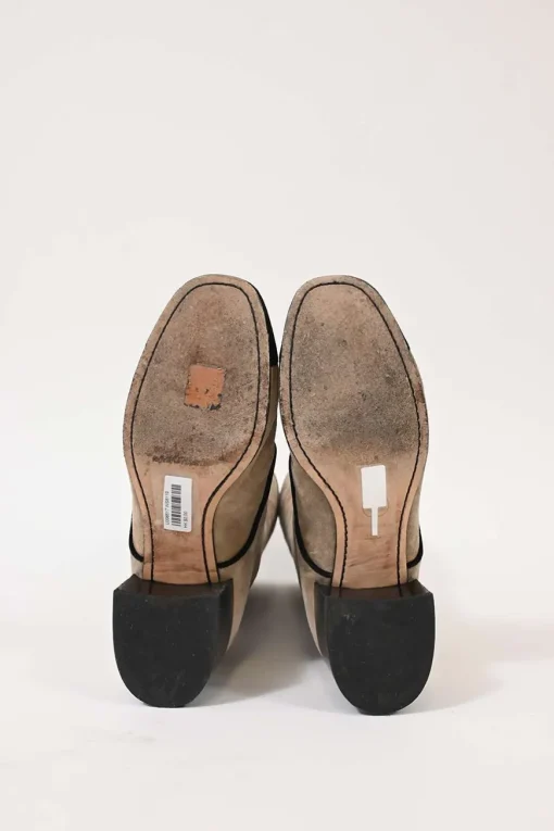 Beige suede lace-up tall boots with contrasting cap toe