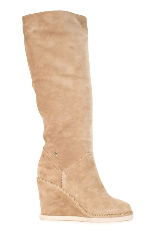 Beige suede lug-sole pull-on knee-high wedge boots with gold-tone metallic chain trim