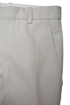 Beige tapered pants with side and back pockets