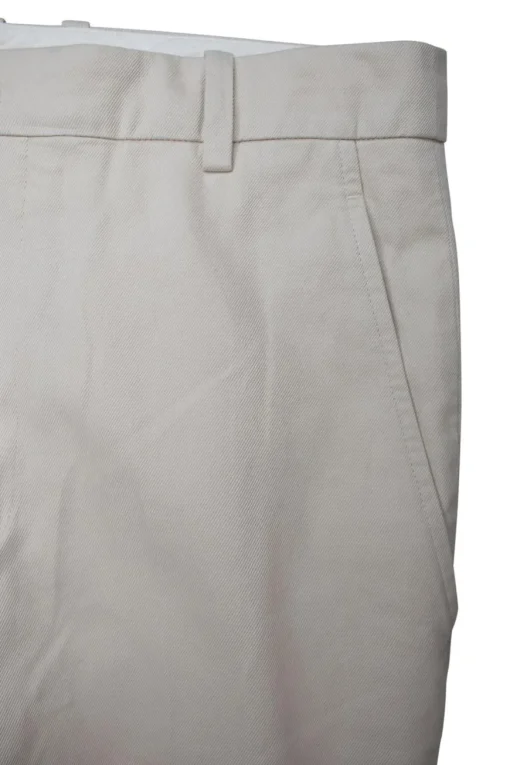 Beige tapered pants with side and back pockets