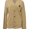 Beige wool button-front cardigan featuring signature chest heart broderie motif