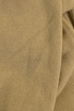 Beige wool button-front cardigan featuring signature chest heart broderie motif