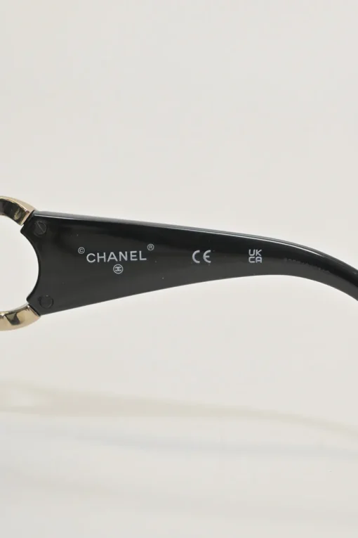 Black acetate and tinted polycarbonate oversized sunglasses with crystal-embellished Coco Mark temples