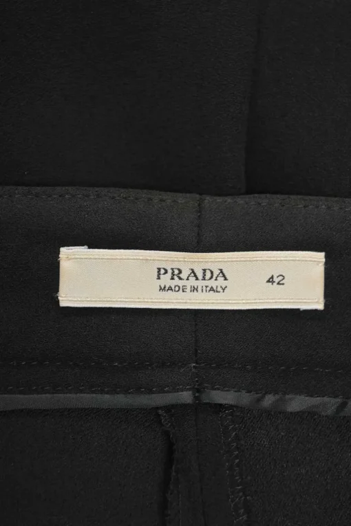 Black acetate-blend low-rise pleat-front tapered leg tailored trousers