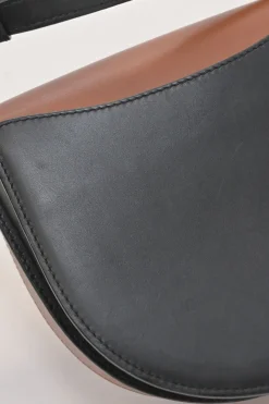Black and brown leather Heel Duo anagram-embossed shoulder flap bag with adjustable shoulder strap