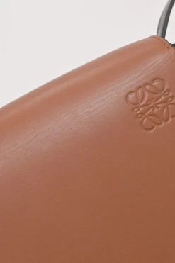 Black and brown leather Heel Duo anagram-embossed shoulder flap bag with adjustable shoulder strap