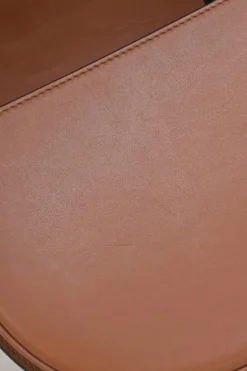Black and brown leather Heel Duo anagram-embossed shoulder flap bag with adjustable shoulder strap