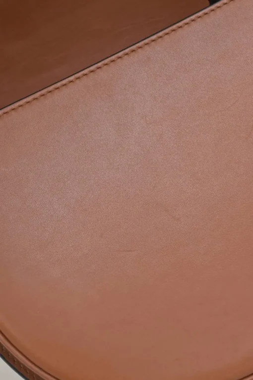 Black and brown leather Heel Duo anagram-embossed shoulder flap bag with adjustable shoulder strap