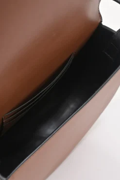 Black and brown leather Heel Duo anagram-embossed shoulder flap bag with adjustable shoulder strap
