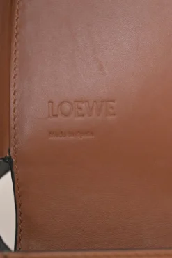 Black and brown leather Heel Duo anagram-embossed shoulder flap bag with adjustable shoulder strap
