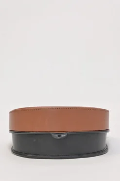 Black and brown leather Heel Duo anagram-embossed shoulder flap bag with adjustable shoulder strap