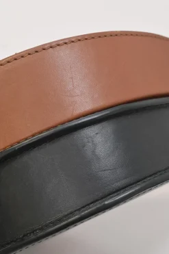 Black and brown leather Heel Duo anagram-embossed shoulder flap bag with adjustable shoulder strap
