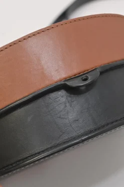 Black and brown leather Heel Duo anagram-embossed shoulder flap bag with adjustable shoulder strap