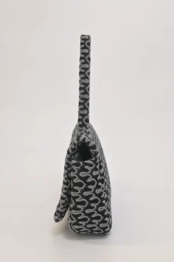 Black and charcoal woolcrochet knit shawl collar robe jacket, apron-style handkerchief skirt and shoulder bag three-piece set