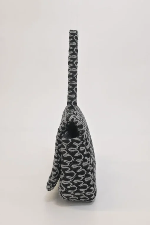 Black and charcoal woolcrochet knit shawl collar robe jacket, apron-style handkerchief skirt and shoulder bag three-piece set