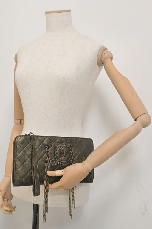 Black and copper aged matelassé leather CC chain wristlet clutch
