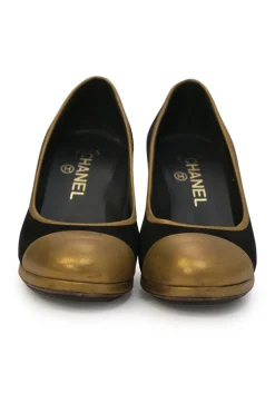 Black and copper suede and leather round-toe platform pumps with contrast cap toe and metallic Coco Mark heel appliqué