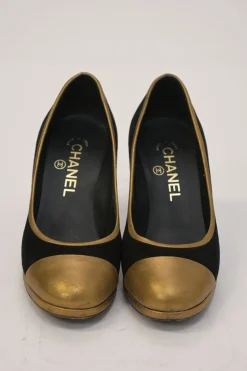 Black and copper suede and leather round-toe platform pumps with contrast cap toe and metallic Coco Mark heel appliqué