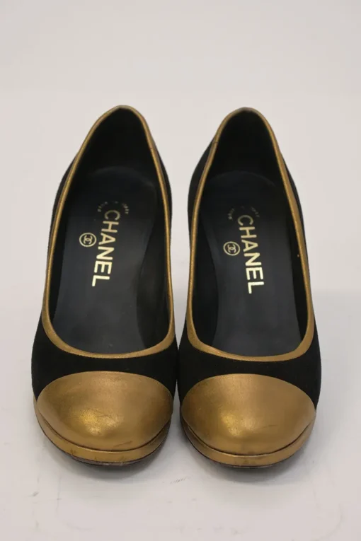 Black and copper suede and leather round-toe platform pumps with contrast cap toe and metallic Coco Mark heel appliqué
